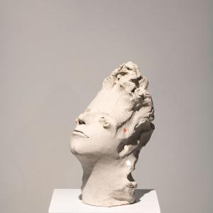 Piccola testa illuminata 14,  2015,  Terracotta e luci led, 12x20x15cm